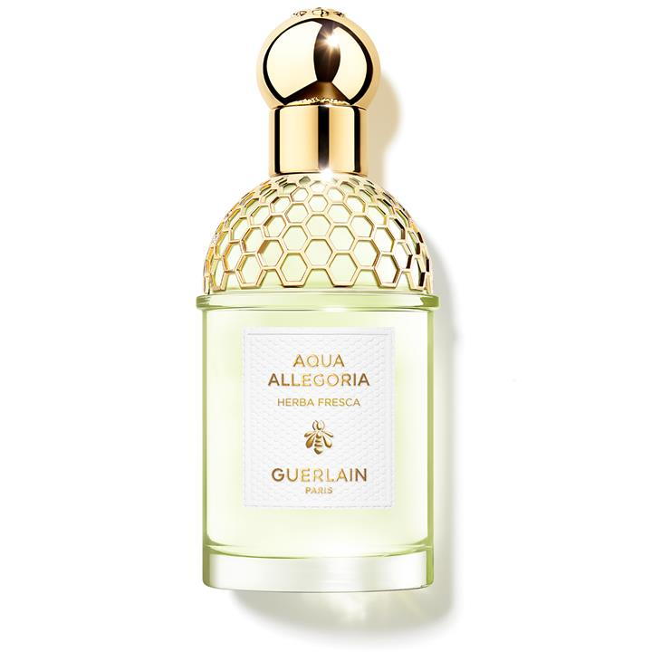 Green glass bottle with a textured gold cap, featuring a honeycomb design, labeled "Aqua Allegoria Herba Fresca" by Guerlain in elegant white and gold lettering.