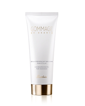White squeeze tube with gold accents, labeled "Gommage De Beaute," containing 2.5oz of skin resurfacing peel by Guerlain, featuring a sleek, modern design.