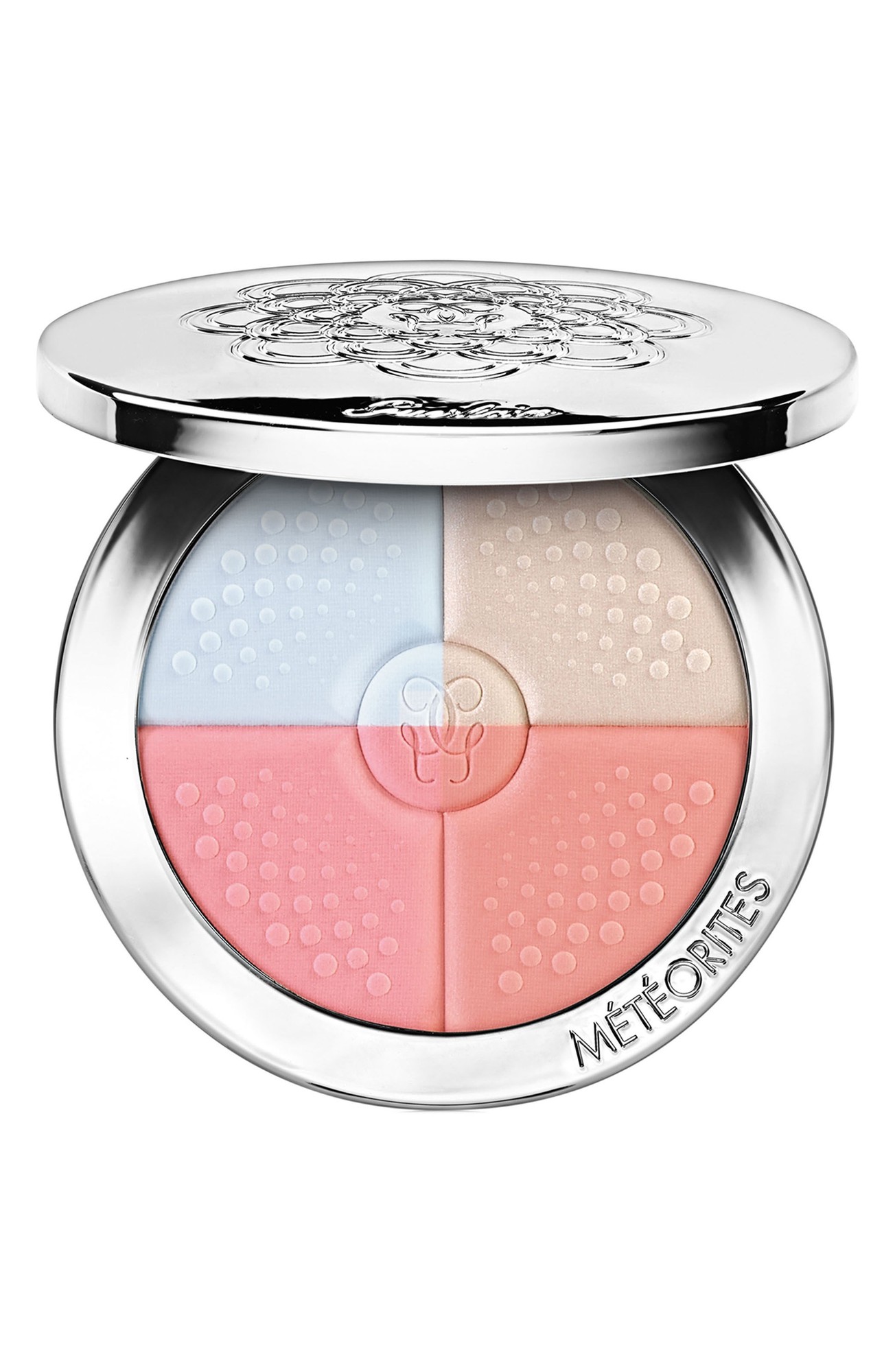 Round compact with a silver lid featuring an embossed floral design, containing four color-correcting powders in pink, peach, beige, and light blue, labeled "Météorites."