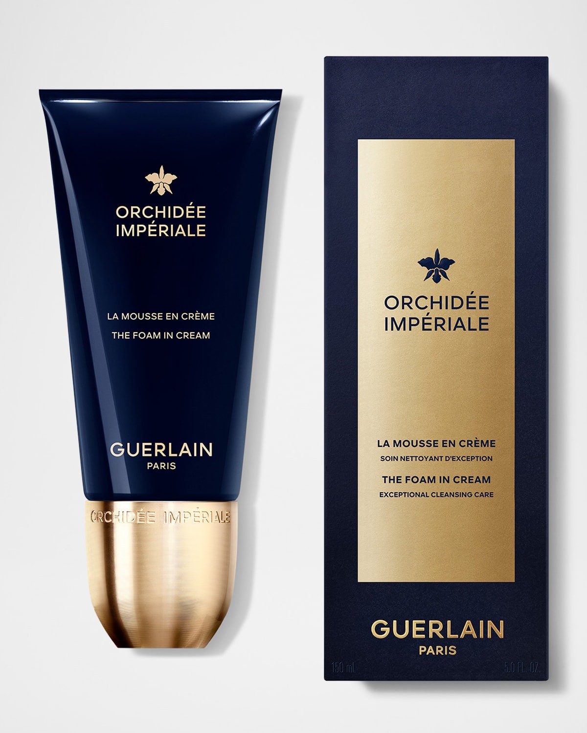 Navy blue tube with gold accents labeled "Orchidée Impériale La Mousse en Crème" alongside a matching box, both featuring the Guerlain logo, 150ml size.