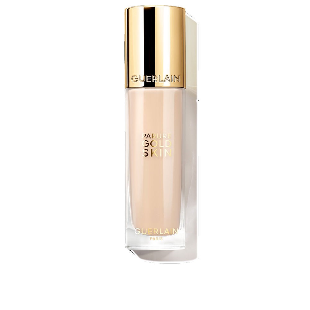 Beige 35 ml Parure Gold Skin Glow Fluid Foundation by Guerlain in a sleek glass bottle with a gold cap, featuring elegant branding on the front.
