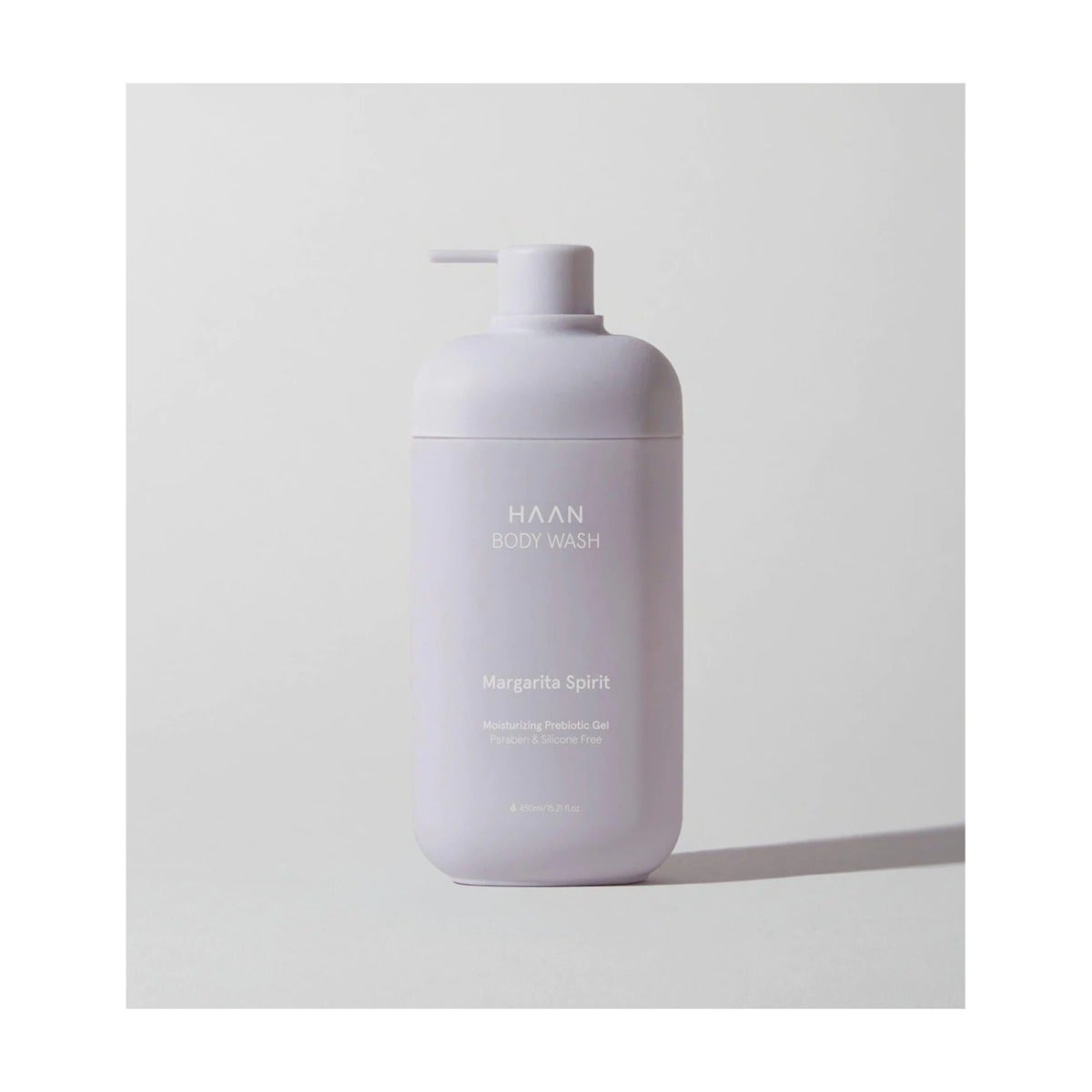 White plastic bottle of HAAN Body Wash Margarita Spirit, featuring a pump dispenser, with minimalist design and text label in a modern font.