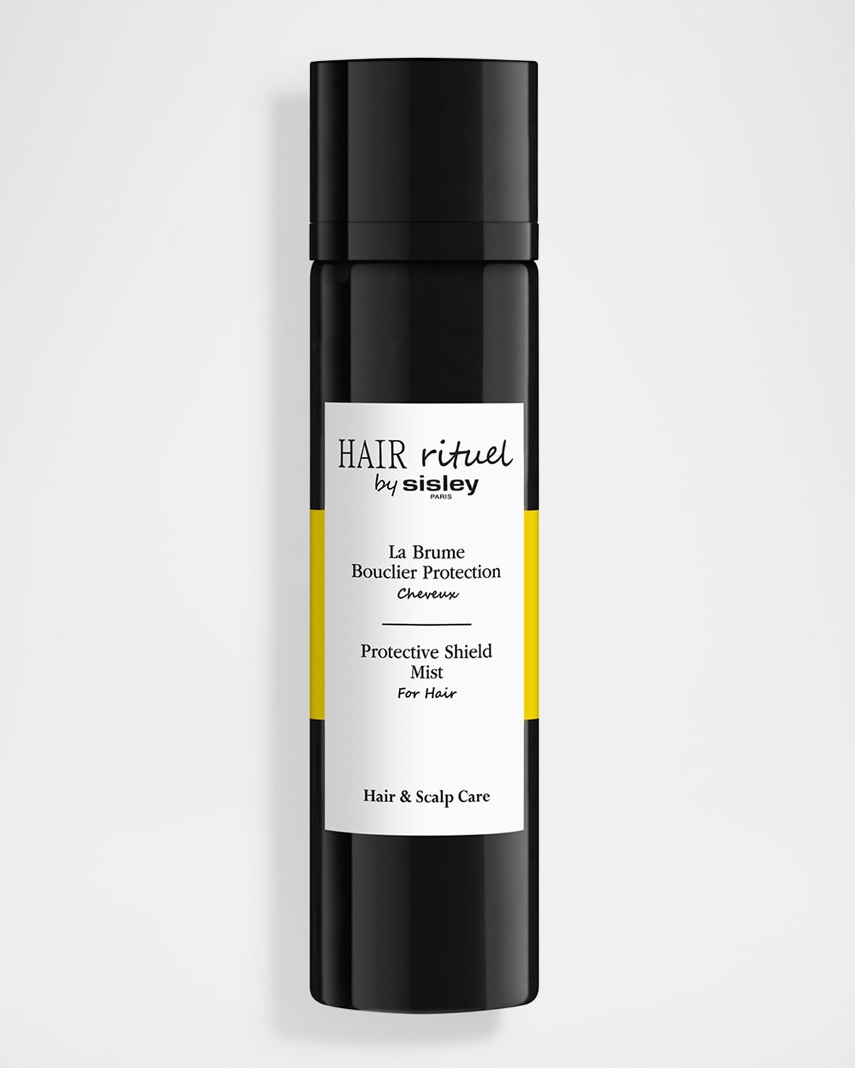 Black spray bottle with a sleek design, featuring a white label and yellow accents, labeled "Protective Shield Mist" for hair and scalp care by Hair Rituel by Sisley.