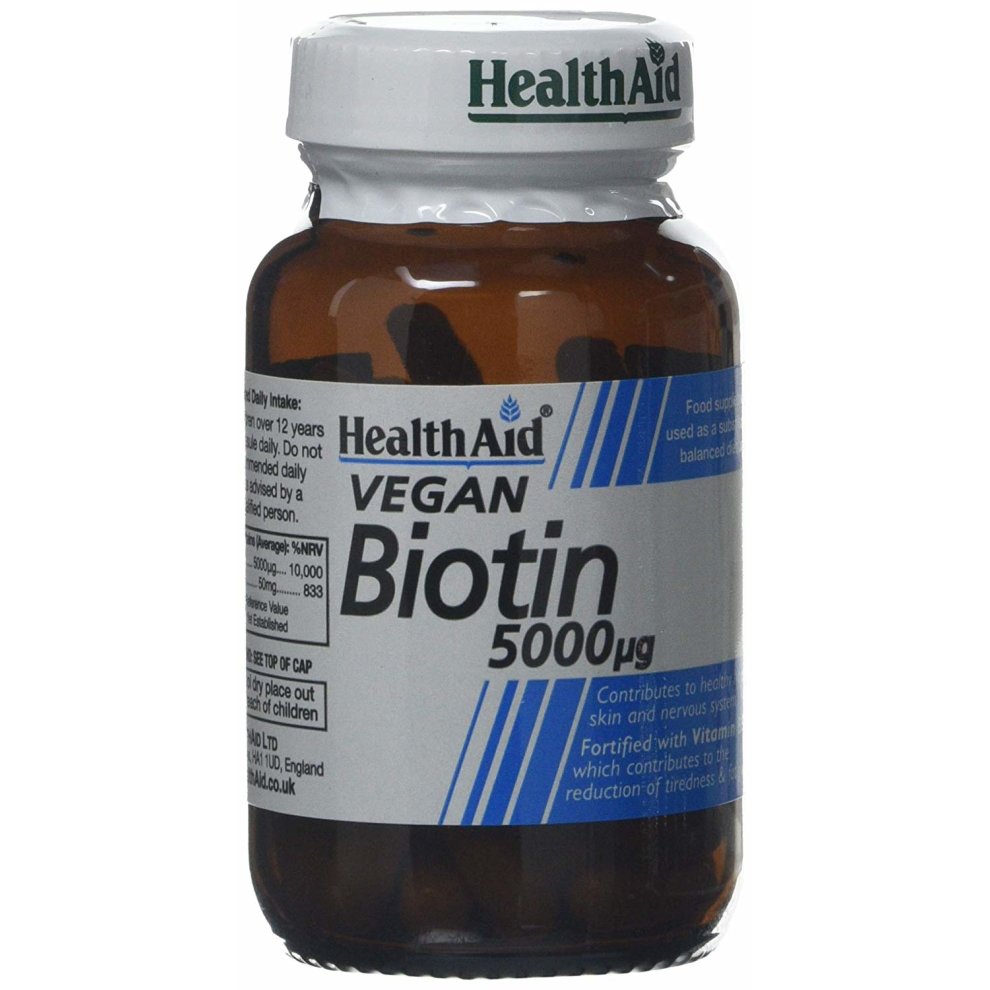 Brown glass bottle with a white and green label, containing 60 vegan capsules of Health Aid Biotin 5000mg, highlighting benefits for skin and hair health.