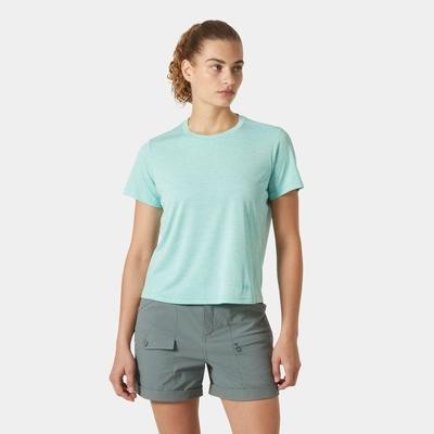 Light teal short-sleeve jersey top with a relaxed fit, made from soft material, paired with gray shorts featuring side pockets.