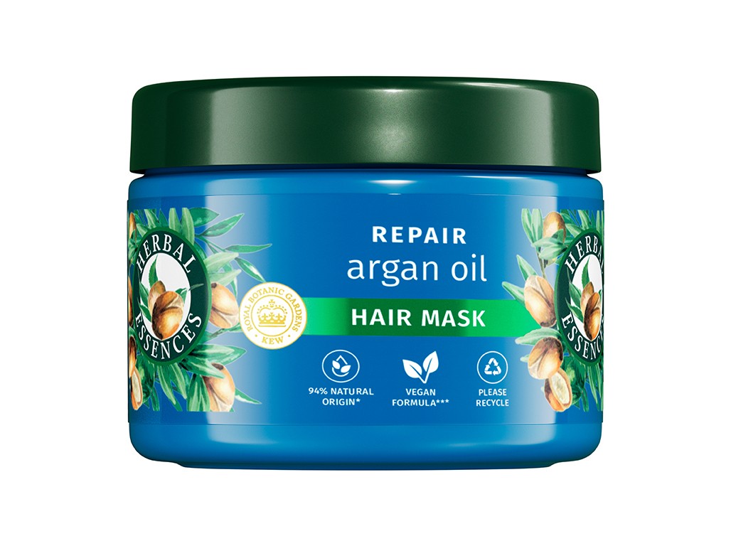 Turquoise jar of Herbal Essences Argan Oil Hair Mask, featuring a green lid, botanical design, and labels indicating 94% natural origin and vegan formula.