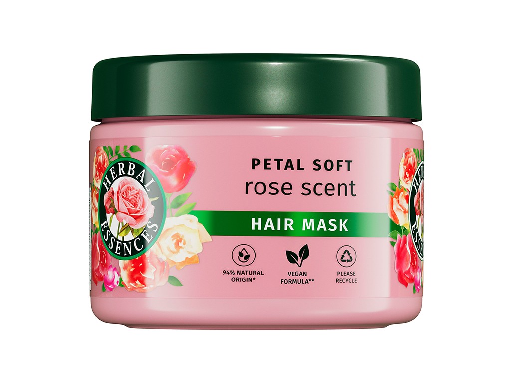 Pink hair mask container with a green lid, featuring floral designs and text highlighting "Petal Soft" and "rose scent," emphasizing its vegan formula and natural ingredients.