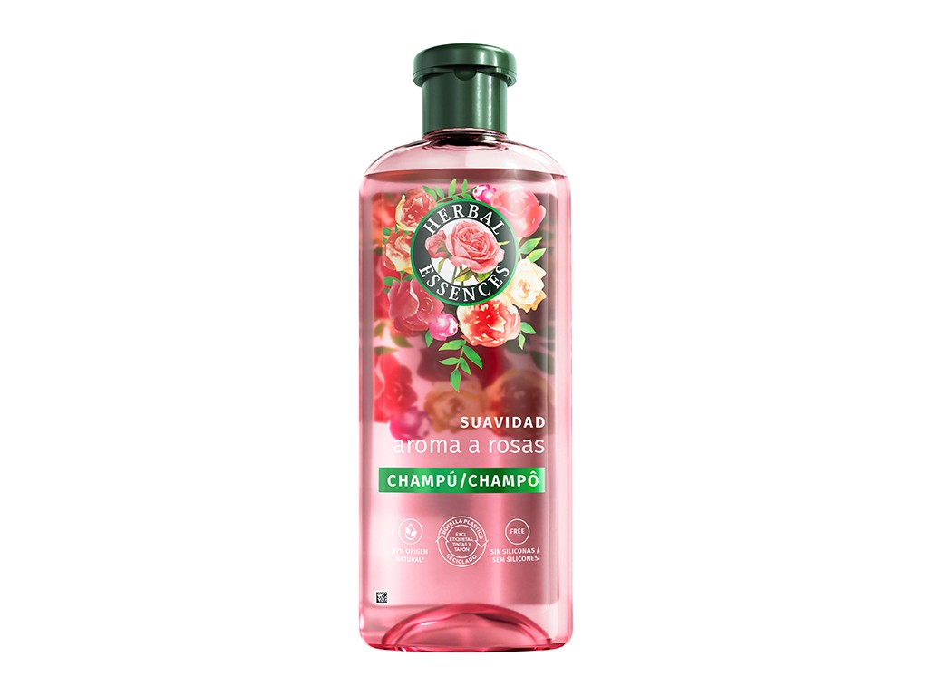 Transparent pink bottle of Herbal Essences Roses Softness Shampoo, featuring a floral design, green cap, and white text stating "Suavidad aroma a rosas" and "Champú."