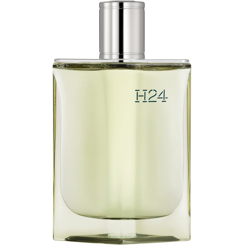 Clear glass bottle with a sleek rectangular shape, featuring a silver spray nozzle and embossed "H24" in blue, containing a light yellow fragrance.
