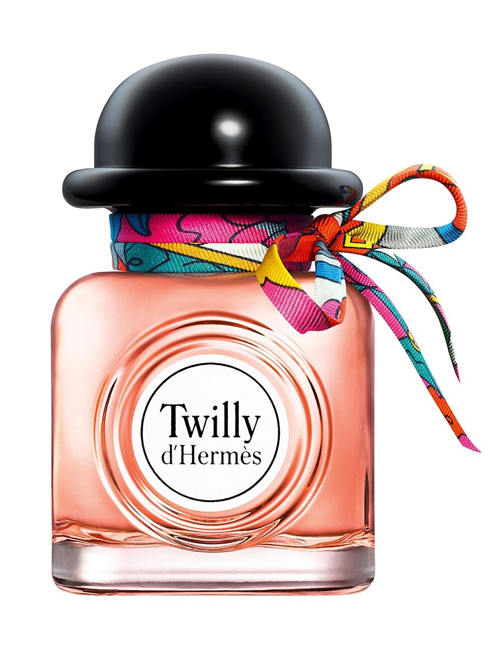 Clear glass bottle with a round base, pink liquid inside, topped with a black cap and adorned with a colorful patterned silk ribbon tied around the neck, labeled "Twilly d'Hermès."