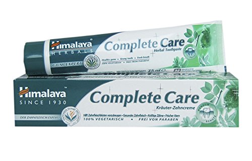 Himalaya Complete Care Herbal Toothpaste 75ml in a green and white tube, featuring herbal graphics and a cardboard box, emphasizing its natural ingredients and vegetarian formula.