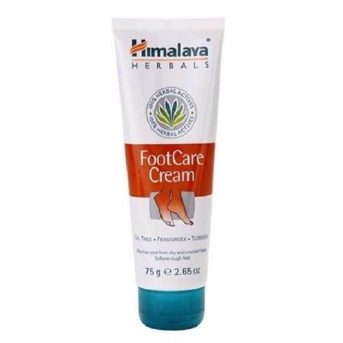 White tube with a flip-top cap, featuring green and orange accents, labeled "Himalaya Foot Care Cream" with herbal ingredients, 75g size, designed for dry and cracked feet.