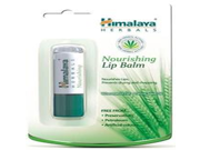 Himalaya Nourishing Lip Balm in a green and white packaging, featuring a sleek tube inside a clear plastic case, with aloe vera graphics and "free from" labels on the front.