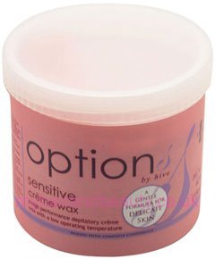 Pink plastic container of Hive Crème Wax, labeled "Sensitive," features a smooth texture and a lid, designed for all skin types, with a note on gentle formula for delicate skin.