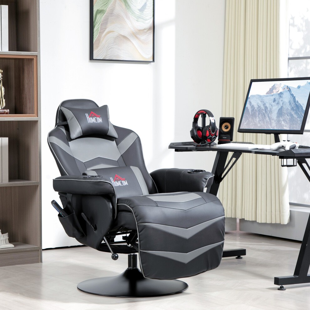 Grey PU leather massage recliner chair with remote, featuring a comfortable padded seat, adjustable recline, and sleek design, positioned beside a desk with a computer and accessories.