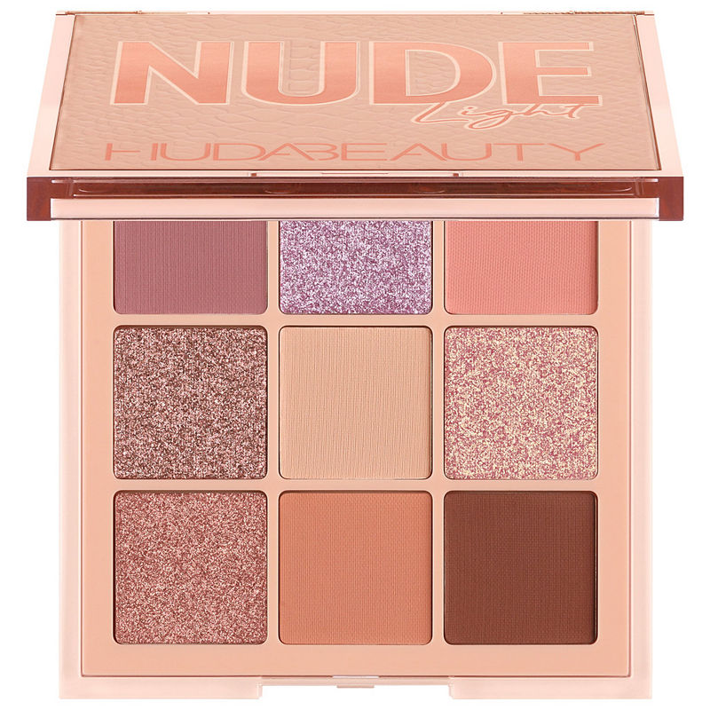 Light nude eyeshadow palette featuring nine shades in pink, mauve, and warm tones, with both matte and shimmer finishes in a sleek, transparent case.