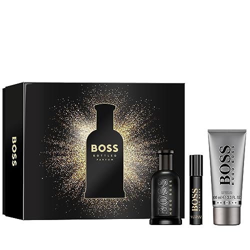 Black box featuring a gold sparkly design, containing a 100ml black glass bottle of Boss Bottled perfume, a travel-sized spray, and a grey gel tube.