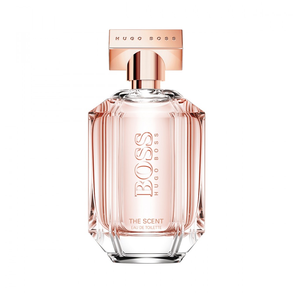 Clear glass bottle with a geometric shape, featuring a rose gold cap and label, containing 3.3 oz of Boss The Scent Her Eau De Toilette by Hugo Boss.