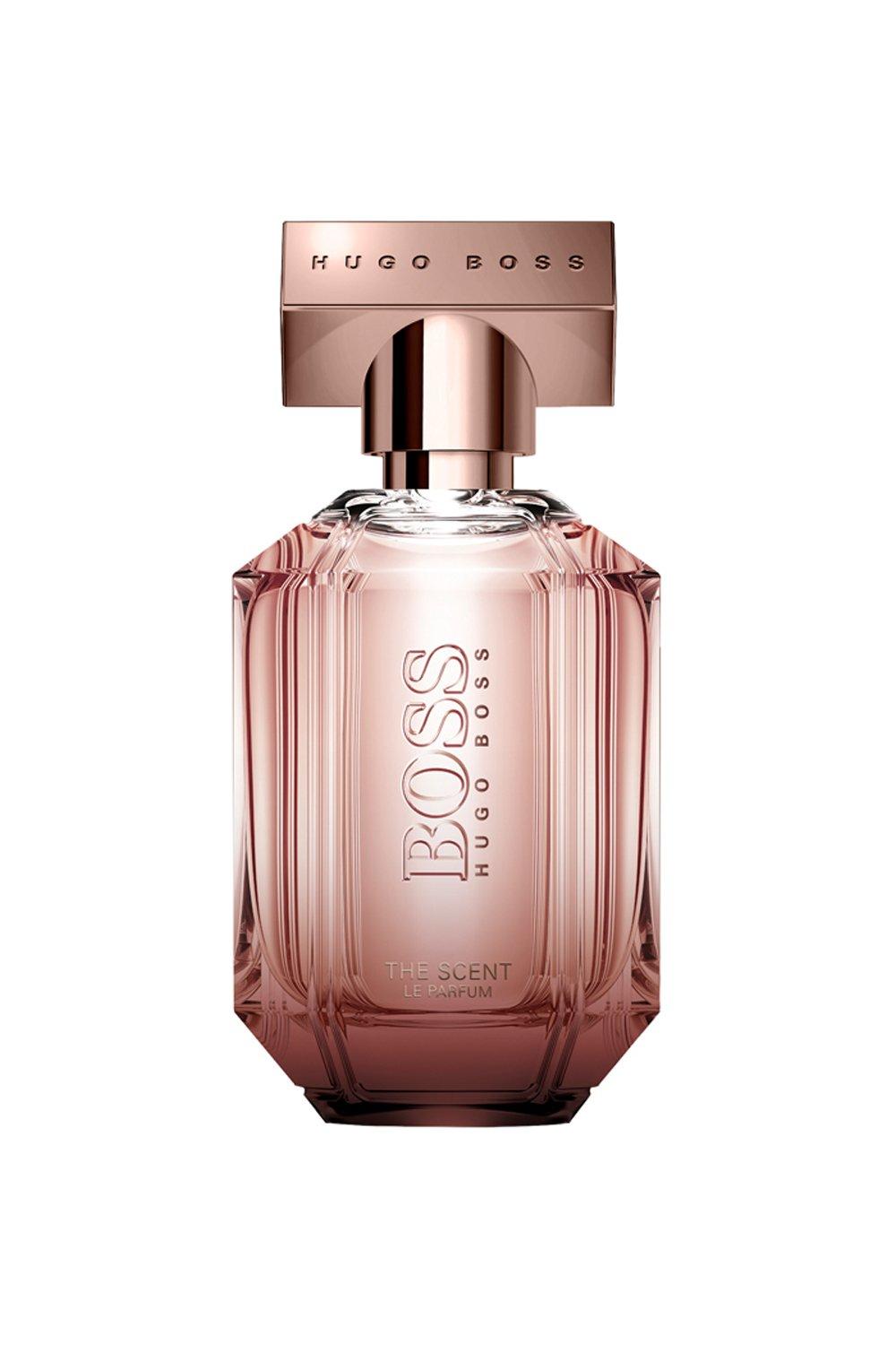Elegant pink glass bottle with a faceted design, featuring a rose gold cap and embossed "BOSS" logo, containing 30 ml of Hugo Boss The Scent Le Parfum EDP.