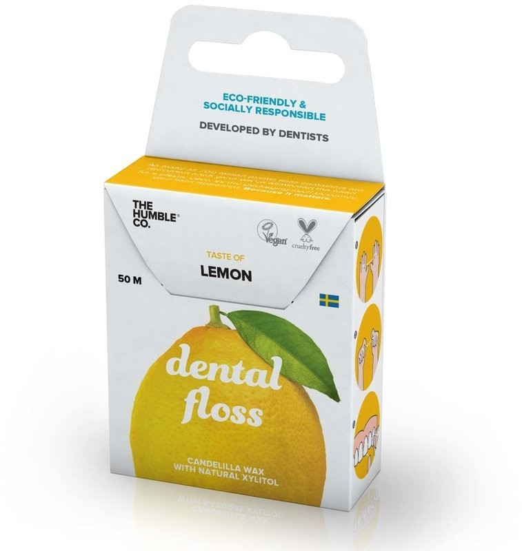 Eco-friendly dental floss in a lemon-flavored variant, packaged in a bright yellow box featuring a lemon graphic, with details on its natural ingredients and vegan certification.