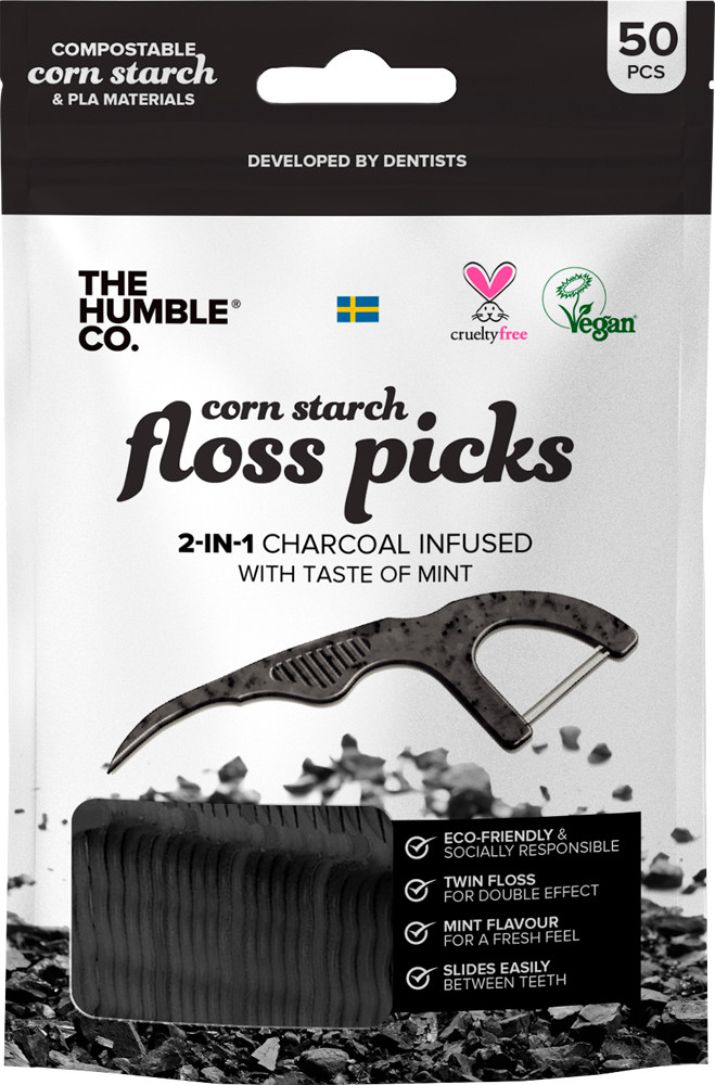 Black compostable floss picks with a mint flavor, featuring a twin flossing design, packaged in a sleek black and white bag labeled "The Humble Co." with 50 pieces.