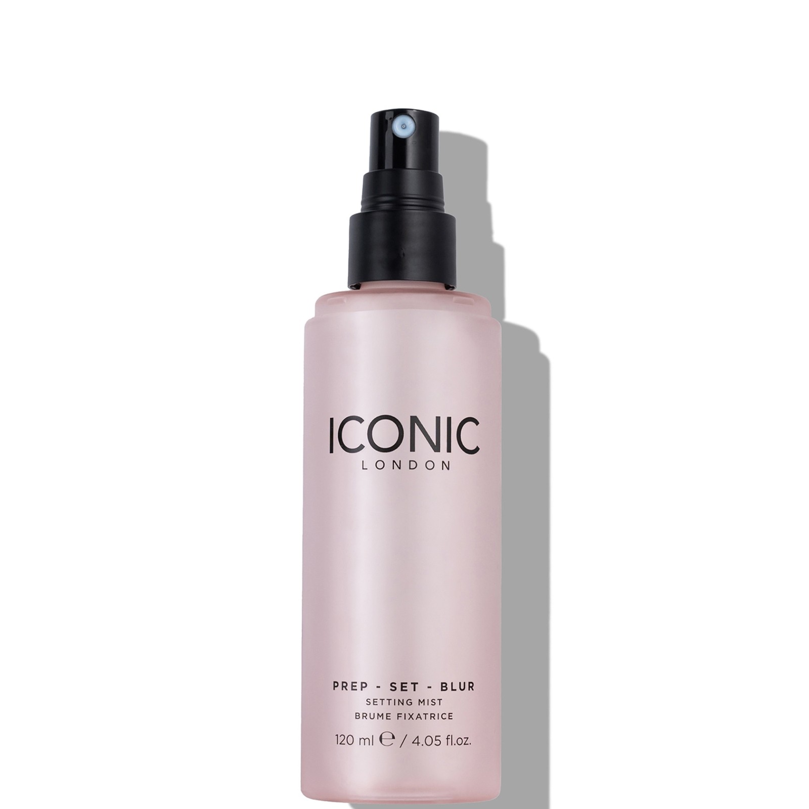 A translucent pink bottle with a black spray nozzle, featuring the text "ICONIC London" and "PREP - SET - BLUR" on the front, containing 120ml of setting spray.