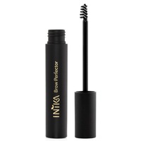 Black tube with gold lettering, containing INIKA Organic Brow Perfector in Walnut shade, features a small brush applicator for precise brow styling.