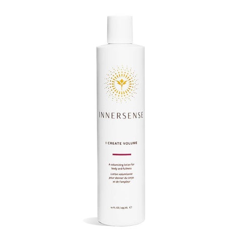White refill pouch featuring a gold sunburst logo, labeled "I Create Volume Lotion," designed to enhance hair fullness and shine, with a capacity of 946ml.