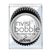 A transparent box containing three slim, black Invisibobble hair rings, featuring a spiral design for gentle hair hold without damage.