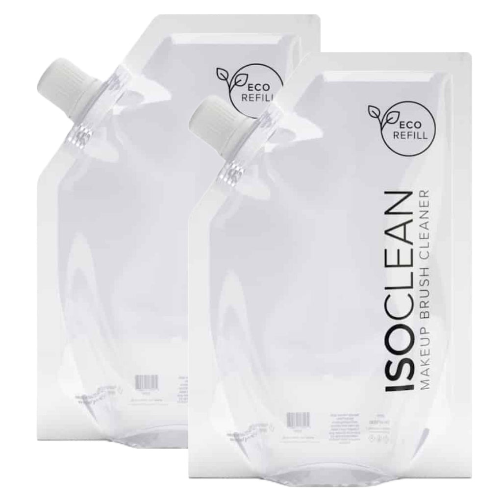 Two transparent, eco-friendly refill pouches of ISOCLEAN makeup brush cleaner, each 525ml, featuring a screw cap and labeled with the brand name and "Eco Refill" logo.