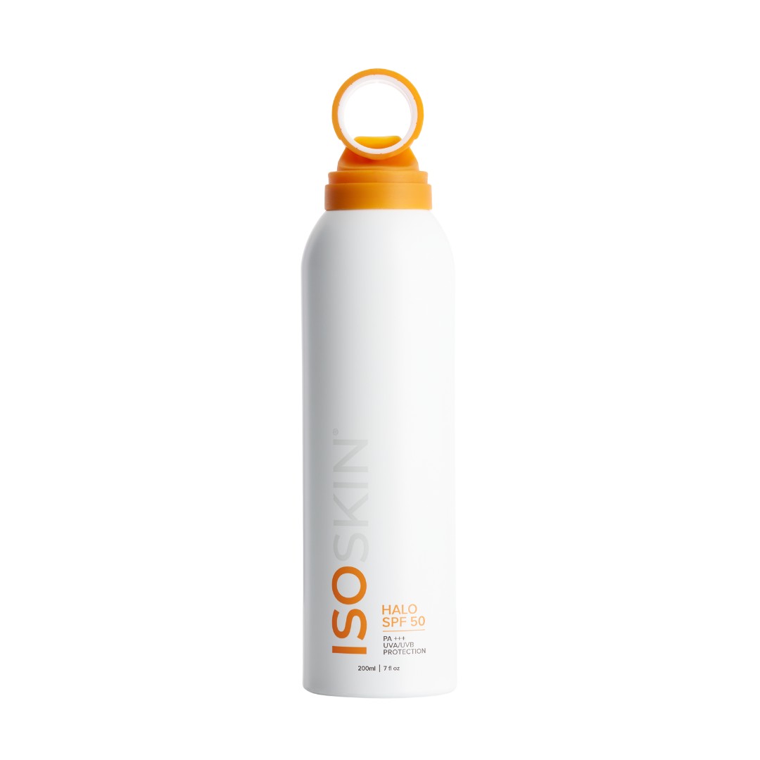 White spray bottle with an orange cap and a looped top, labeled "ISOSKIN Halo Spray Sunscreen SPF50 - PA+++ UVA/UVB Protection," featuring a sleek design.