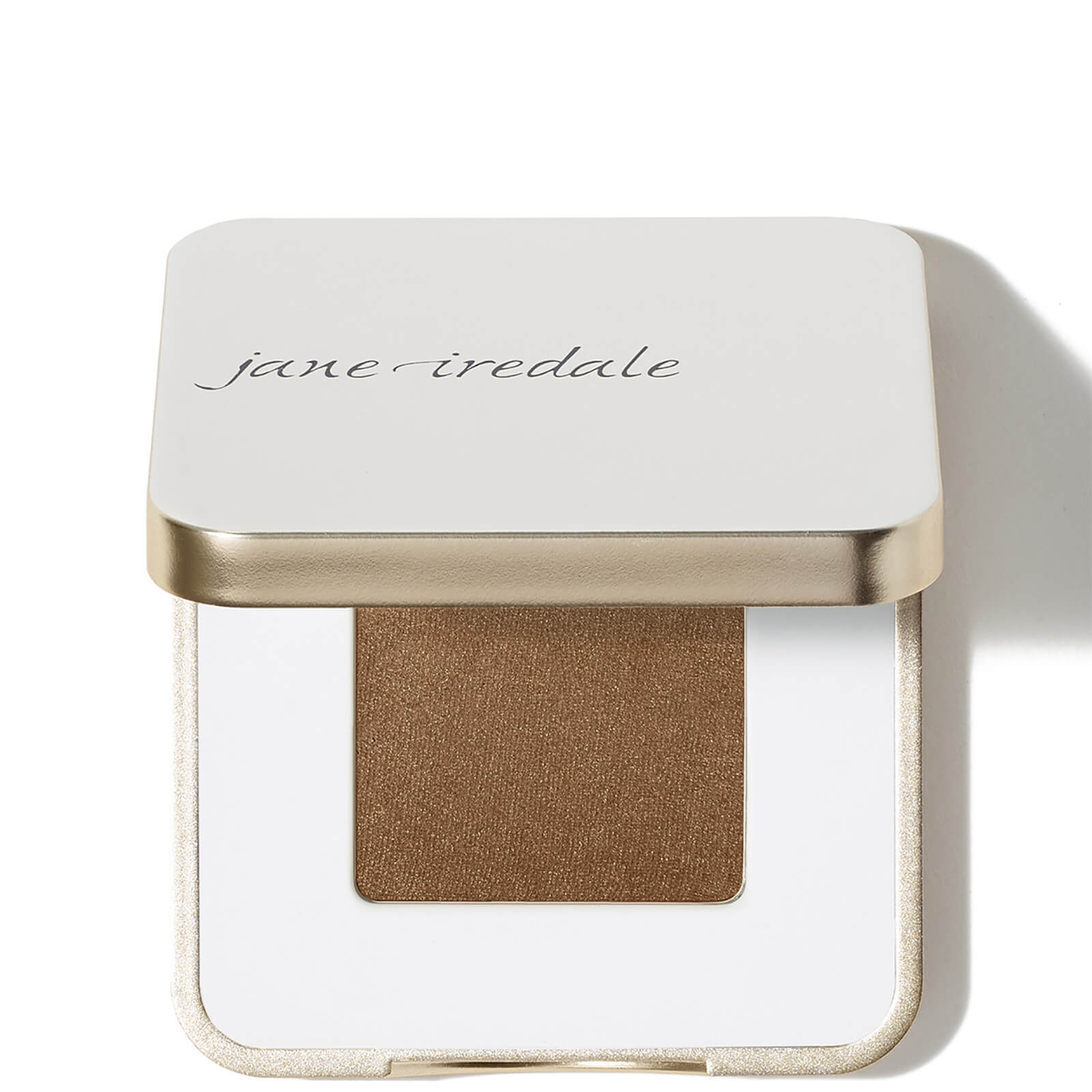 Compact featuring a square, gold-trimmed lid with "jane iredale" embossed, containing a rich, shimmering brown eye shadow in a white base.