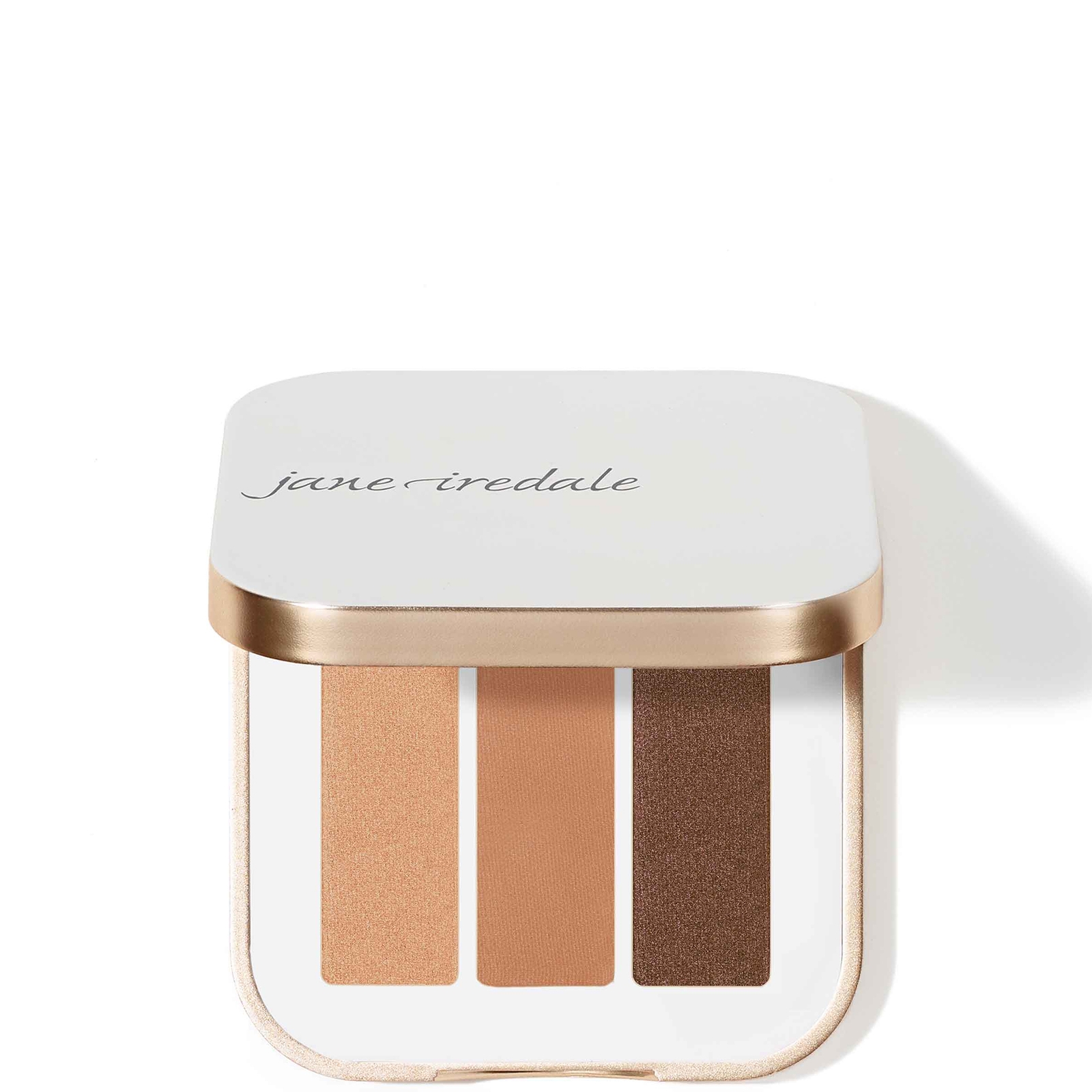 Compact eye shadow palette featuring three shades: a light beige, a warm tan, and a rich brown, housed in a sleek white case with a gold trim.