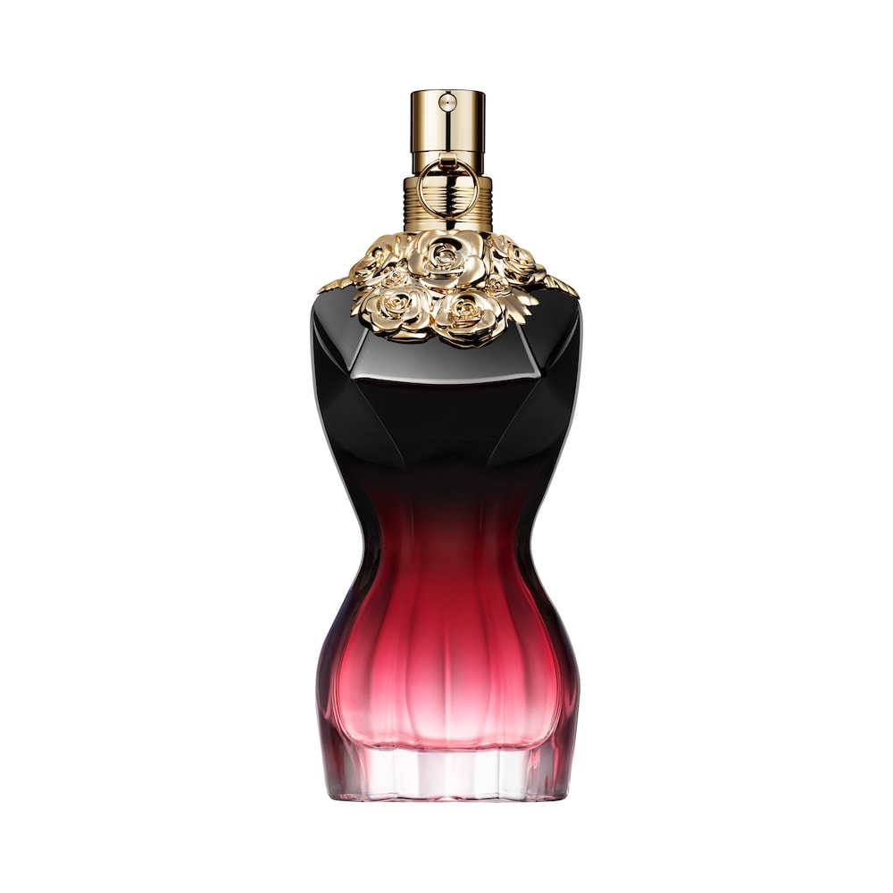 Elegant bottle shaped like a woman's silhouette, featuring a gradient from deep black to pink, adorned with gold rose accents and a gold spray nozzle.