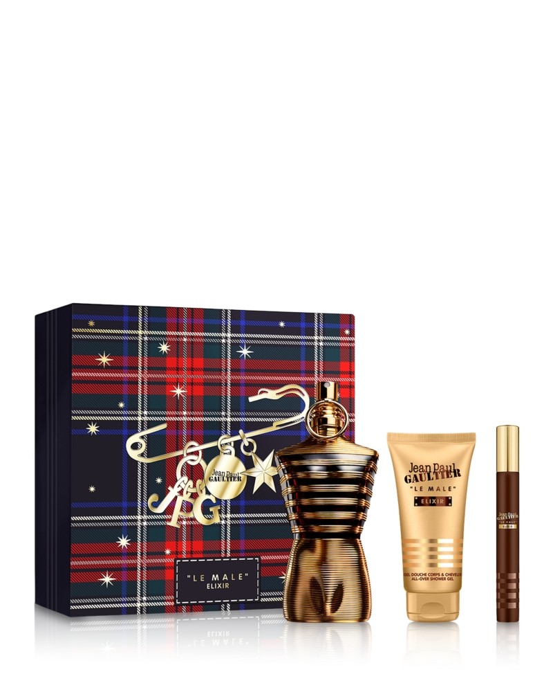 Jean Paul Gaultier Le Male Elixir set featuring a gold-toned bottle in a muscular torso shape, a plaid gift box, a gold cream tube, and a mini spray.