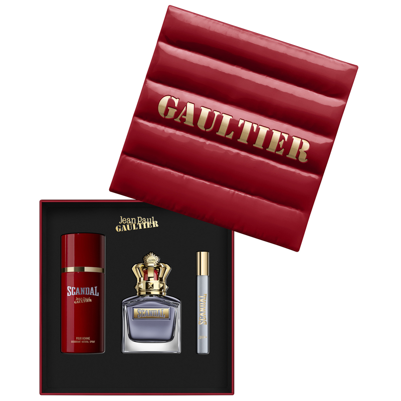 Red gift box with gold lettering "GAULTIER" contains a 3.4oz EDT spray, a 0.34oz EDT spray, and a 5.1oz deodorant spray, all featuring bold, stylish packaging.