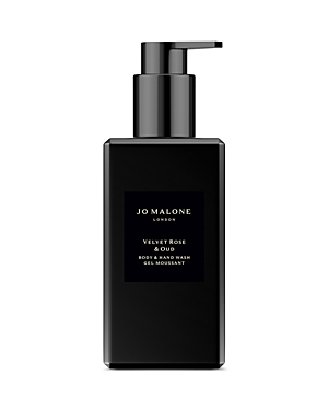 Black rectangular bottle with a pump dispenser, featuring a sleek design and a label that reads "Jo Malone London Velvet Rose & Oud Body & Hand Wash 8.5 Oz."