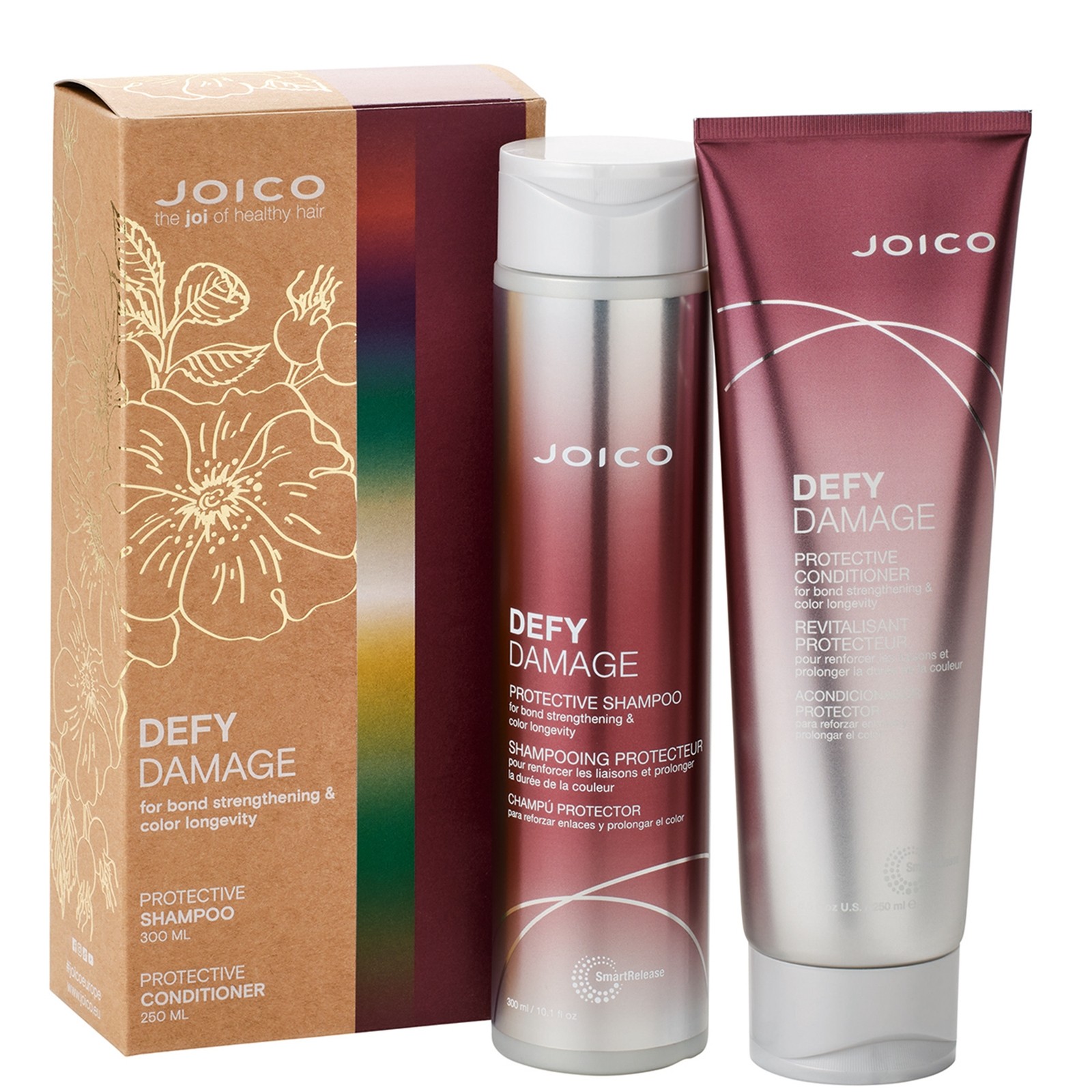 Burgundy shampoo and conditioner duo in sleek metallic tubes, packaged in a floral-printed box, designed for bond strengthening and color longevity.