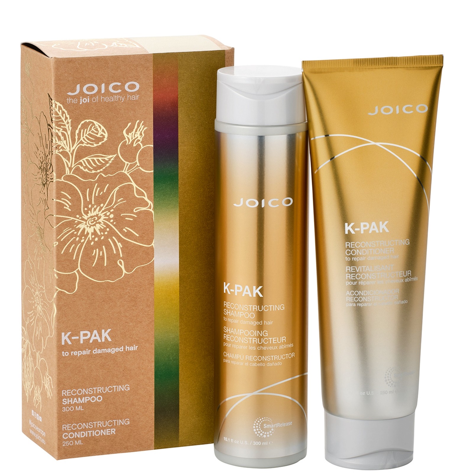 Gold packaging featuring Joico K-Pak Reconstructing Shampoo and Conditioner duo, with sleek bottles and a decorative box adorned with floral designs.