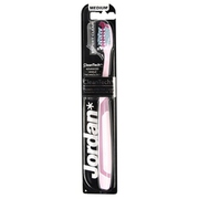 Jordan Expert Clean CleanTech toothbrush in medium size, featuring a pink handle and soft bristles, packaged in a sleek, black and white cardboard backing.