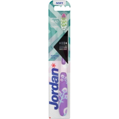Jordan Individual Clean Soft Toothbrush features a medium head, soft bristles, and a purple handle with floral designs, packaged in a clear plastic blister.