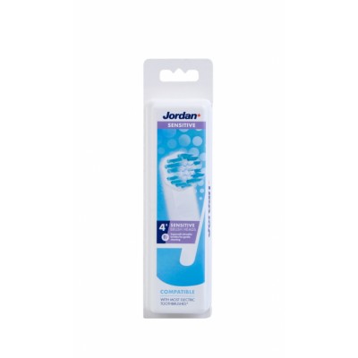 Four Jordan Sensitive Brush Heads in a clear plastic packaging, featuring a blue and white design, labeled as compatible with most electric toothbrushes.