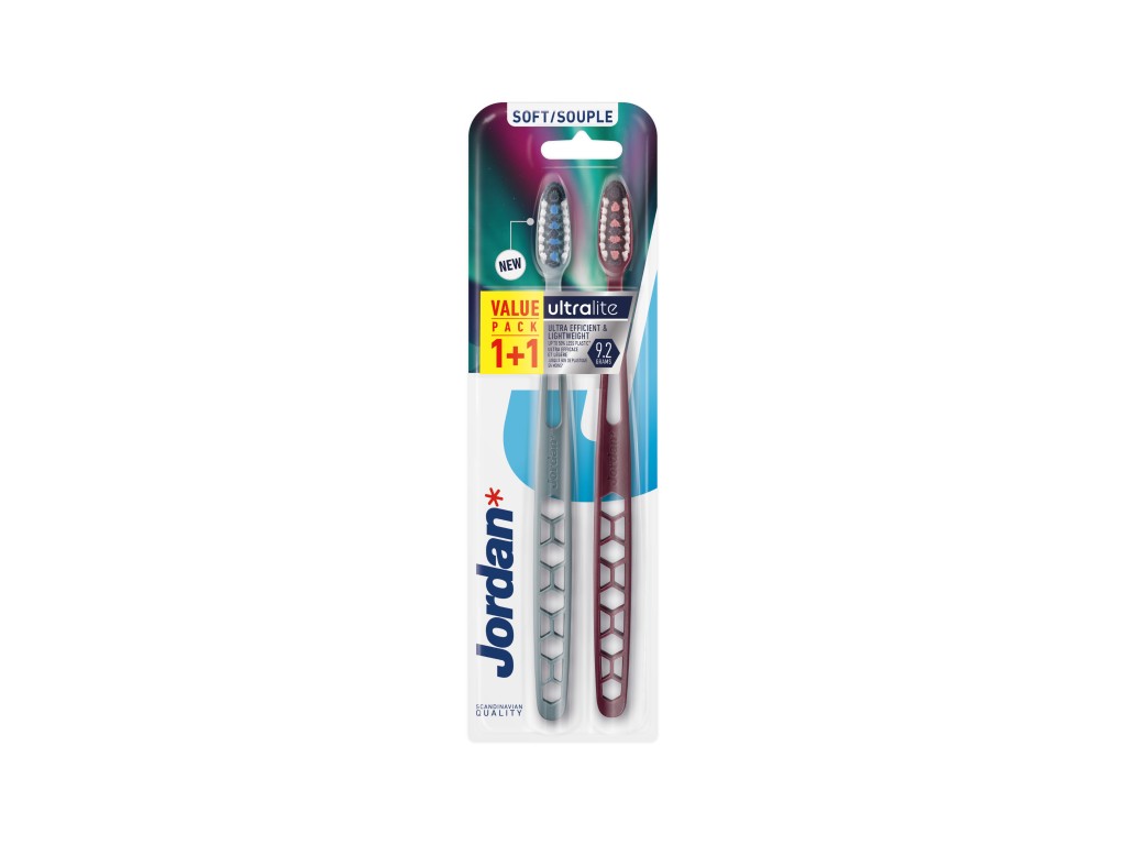 Two soft-bristled toothbrushes in a value pack, featuring a blue and maroon color scheme, with ergonomic handles and a hexagonal design for effective cleaning.