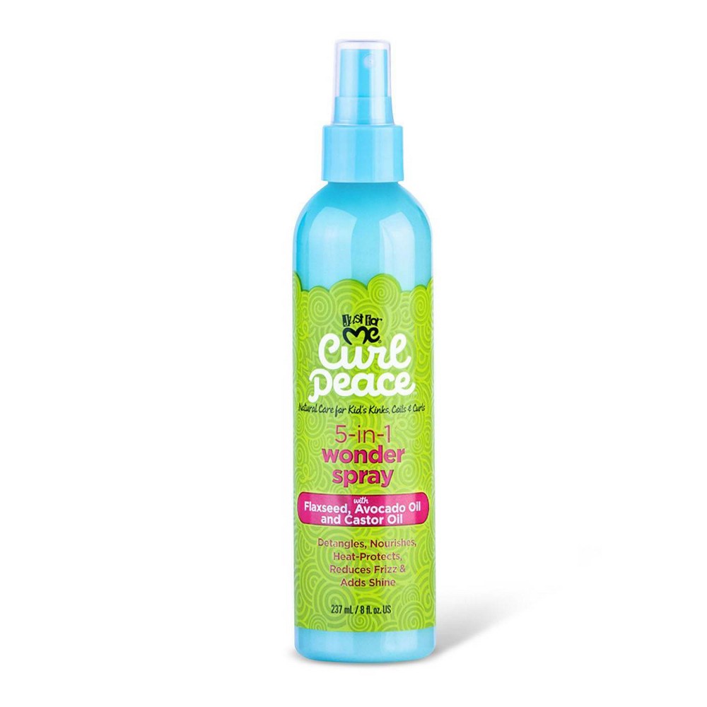 Light blue spray bottle with a green patterned label, featuring "Just for Me! Curl Peace 5-N-1 Wonder Spray" in pink text, highlighting ingredients like flaxseed, avocado oil, and castor oil.