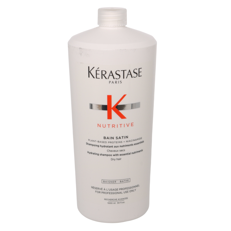 White plastic bottle of Kérastase Nutritive Bain Satin Hydrating Shampoo, featuring a red "K" logo, 1000ml size, labeled for dry hair with essential nutrients.