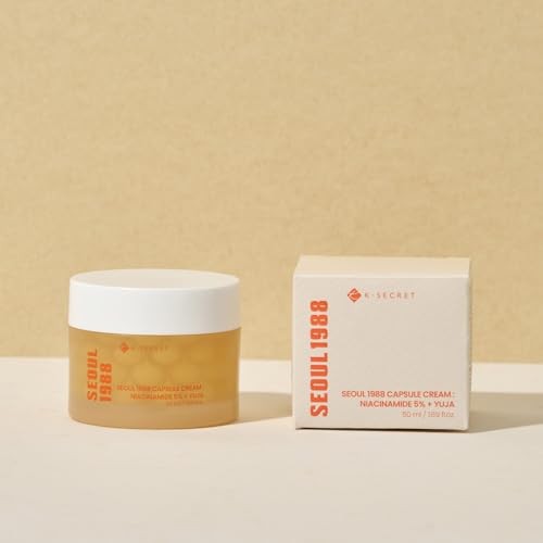 Yellow jar with a white lid labeled "SEOUL 1988" beside a matching cream box, both featuring minimalist design and text, highlighting Niacinamide 5% and Yuja ingredients.