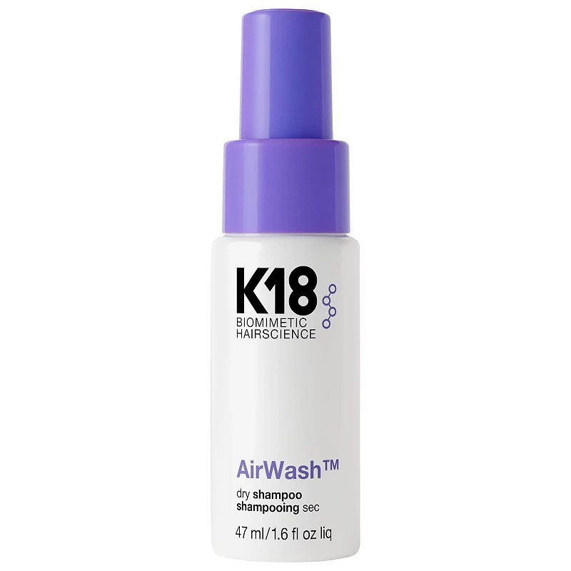 K18 Biomimetic Hairscience Mini AirWash™ Dry Shampoo in a 1.6 oz white bottle with a purple cap, featuring a sleek design and clear labeling of the product name and type.