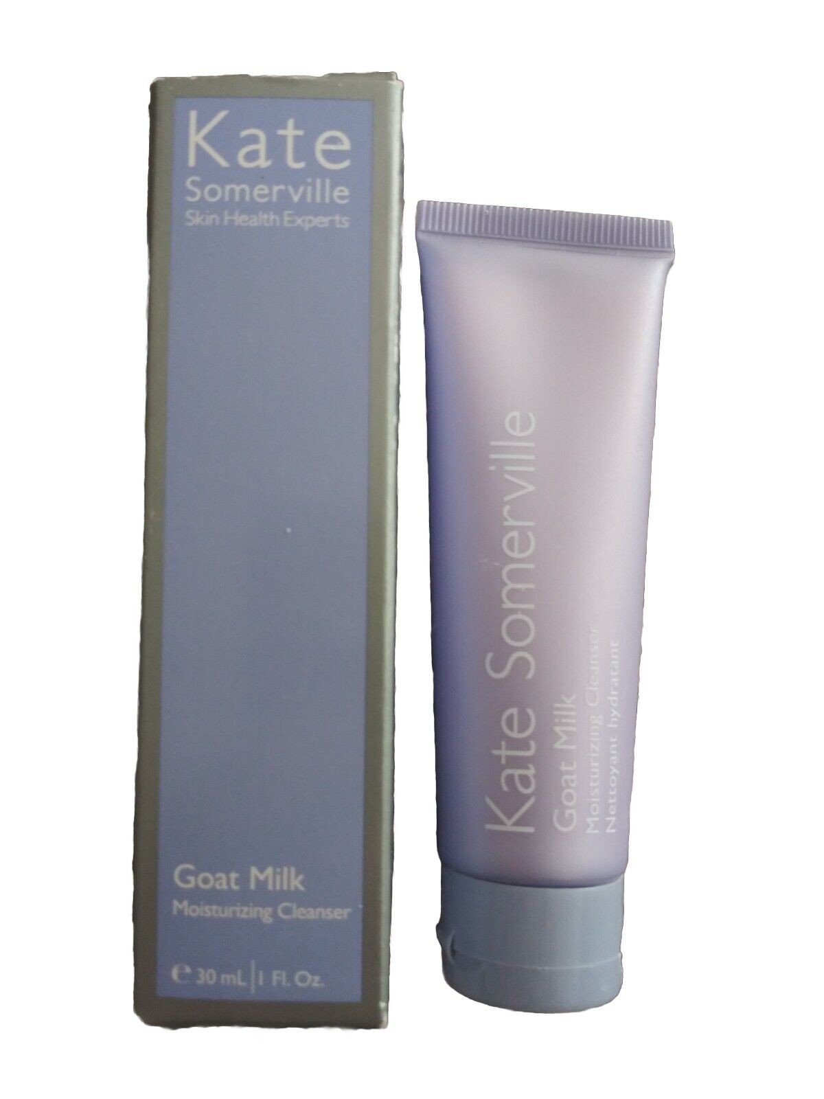 Light purple tube of Kate Somerville Goat Milk Moisturizing Cleanser, 30ml, alongside a matching box with silver accents and text highlighting its moisturizing properties.