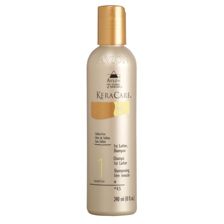 KeraCare First Lather Shampoo in a gold and cream bottle, featuring a flip-top cap and a sleek design, labeled with "1st Lather" and "240 ml" in elegant font.