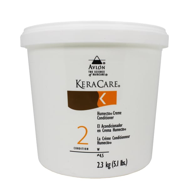 White plastic container with a screw-on lid, labeled "KeraCare Humecto Creme Conditioner" in brown and orange text, featuring a large "2" and a net weight of 2.3 kg.